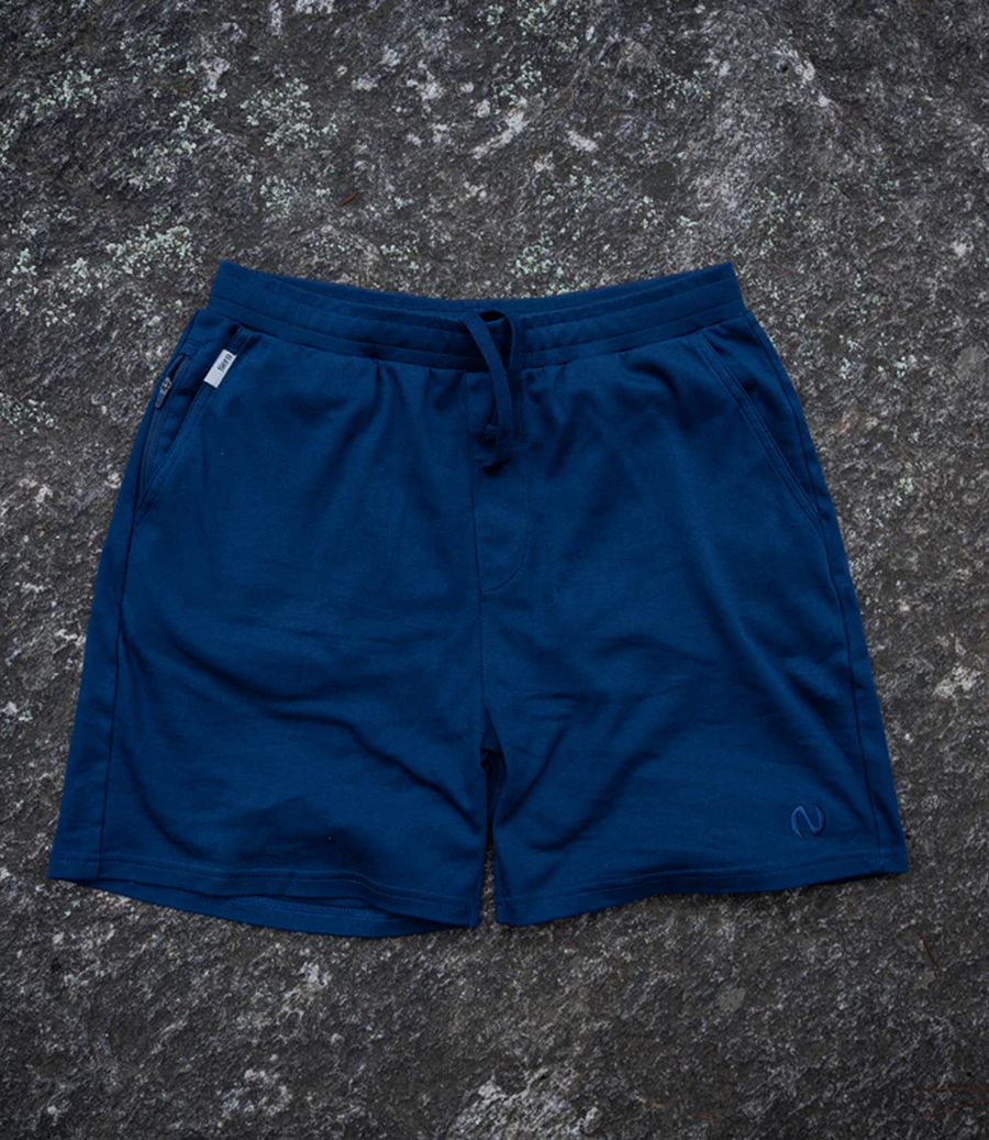 Nero merino liner shorts laid flat, organic cotton shell in navy