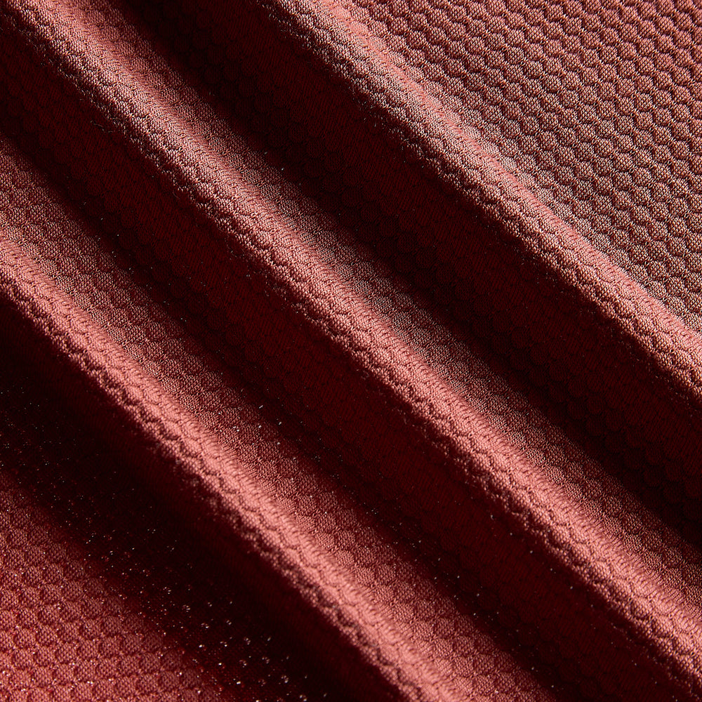Close up of burnt clay merino and Tencel training fabric